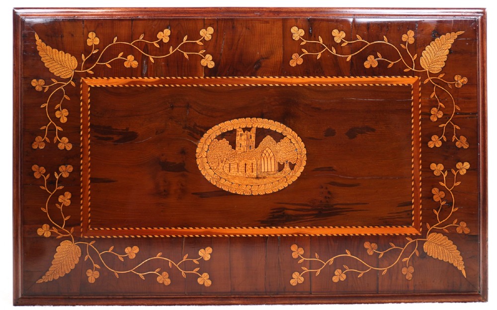 A set of three nested wooden side tables featuring detailed marquetry inlays of foliage and central vignettes, supported by slender turned legs and scroll feet. View XXVIII