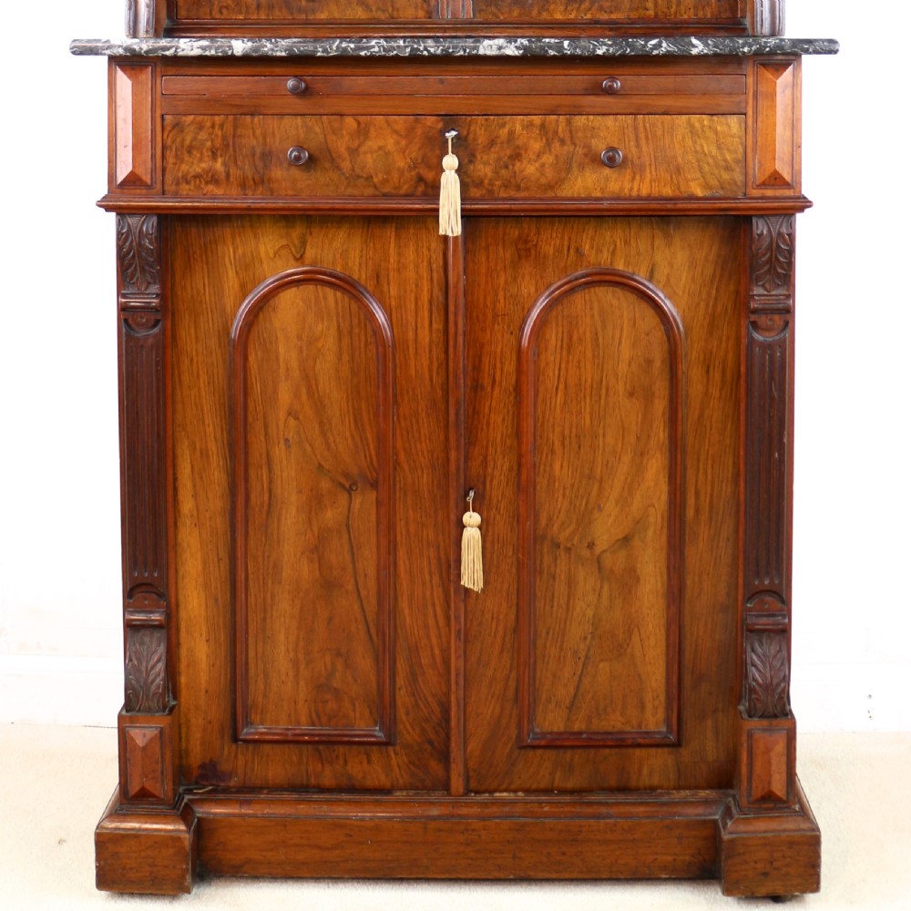 A 19th-century Victorian burr walnut dentist cabinet with a roll-top upper section, shallow drawers, grey marble work surface, and lower two-door cupboard. View V