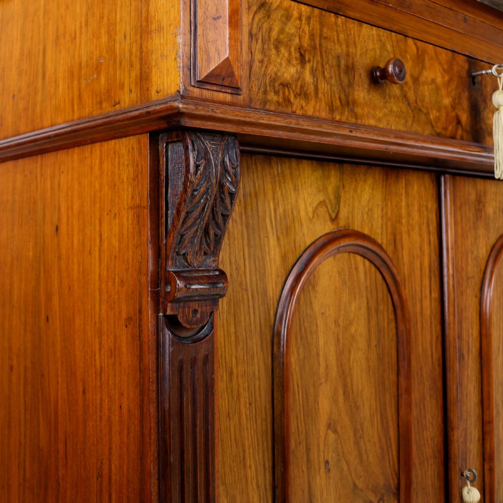 A 19th-century Victorian burr walnut dentist cabinet with a roll-top upper section, shallow drawers, grey marble work surface, and lower two-door cupboard. View VII