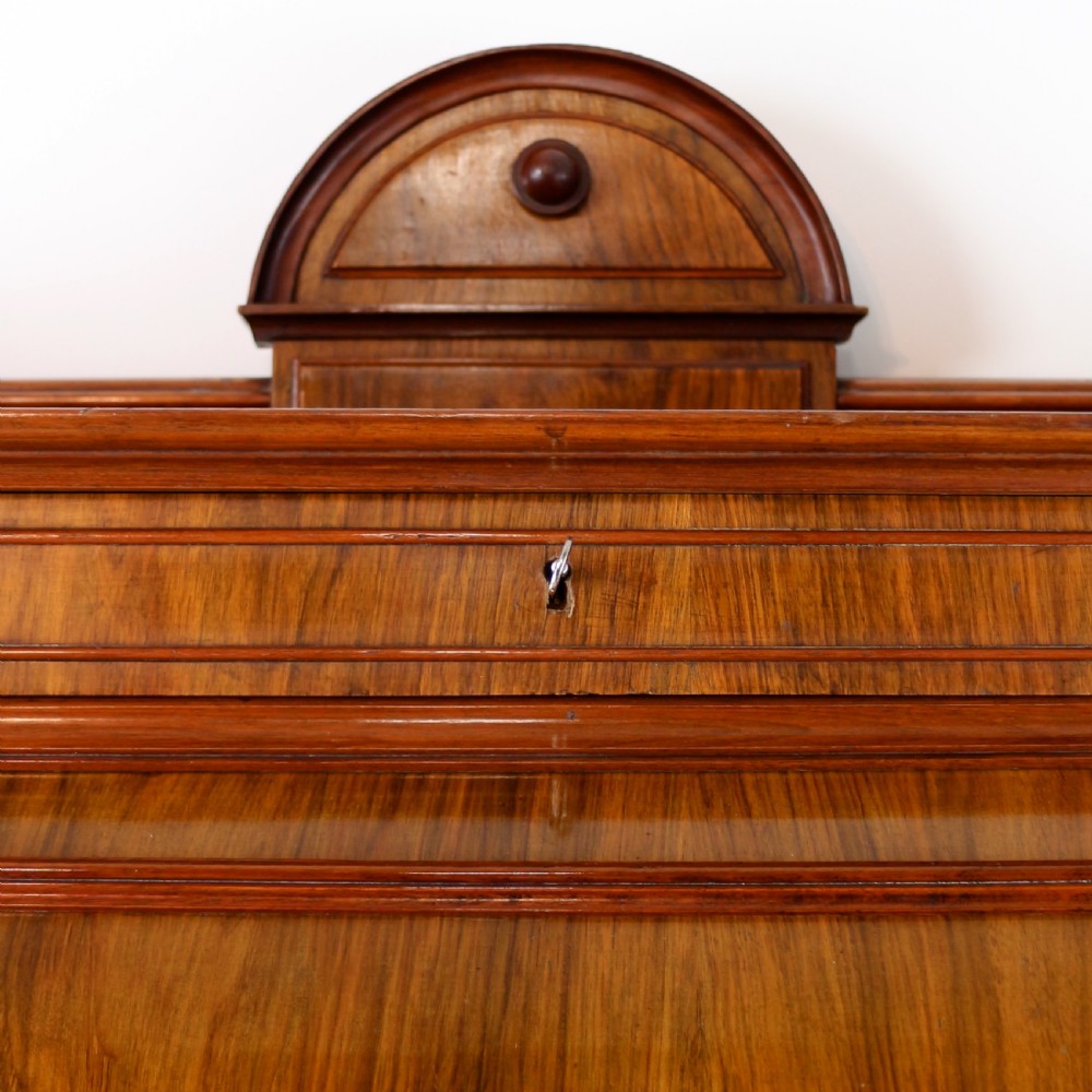 A 19th-century Victorian burr walnut dentist cabinet with a roll-top upper section, shallow drawers, grey marble work surface, and lower two-door cupboard. View VIII