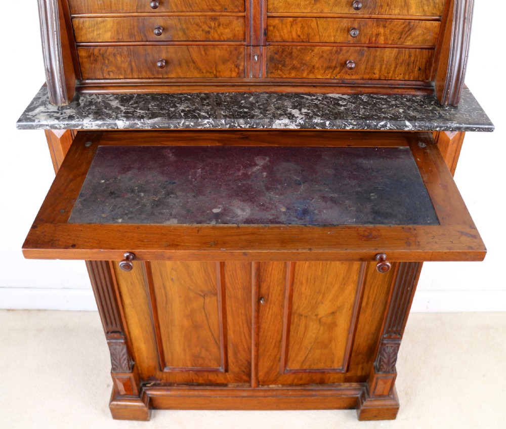 A 19th-century Victorian burr walnut dentist cabinet with a roll-top upper section, shallow drawers, grey marble work surface, and lower two-door cupboard. View XVIII
