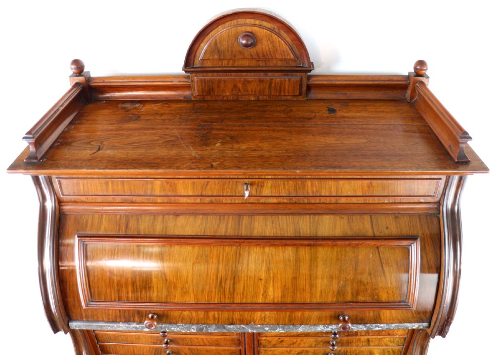 A 19th-century Victorian burr walnut dentist cabinet with a roll-top upper section, shallow drawers, grey marble work surface, and lower two-door cupboard. View XIX