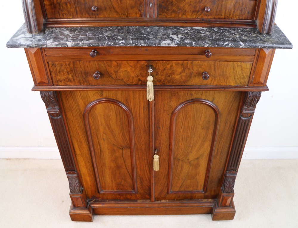 A 19th-century Victorian burr walnut dentist cabinet with a roll-top upper section, shallow drawers, grey marble work surface, and lower two-door cupboard. View XX