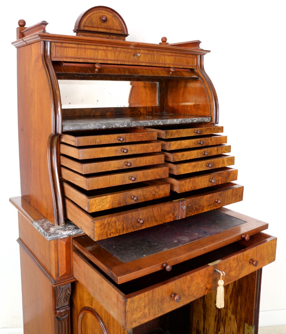 A 19th-century Victorian burr walnut dentist cabinet with a roll-top upper section, shallow drawers, grey marble work surface, and lower two-door cupboard. View XXII