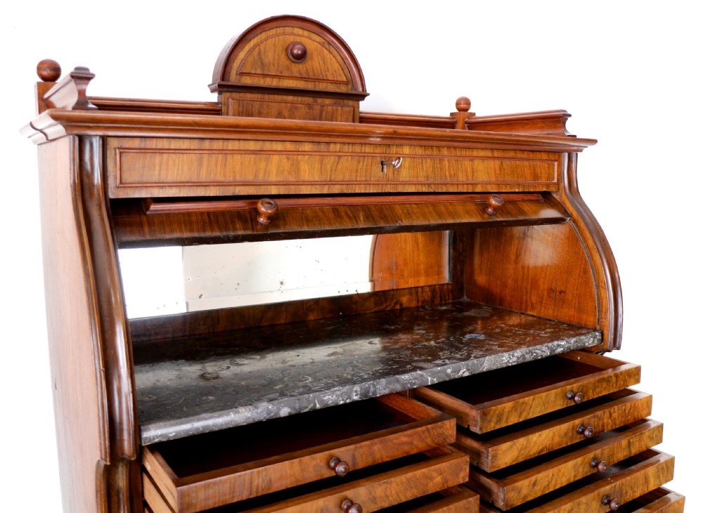 A 19th-century Victorian burr walnut dentist cabinet with a roll-top upper section, shallow drawers, grey marble work surface, and lower two-door cupboard. View XXIII