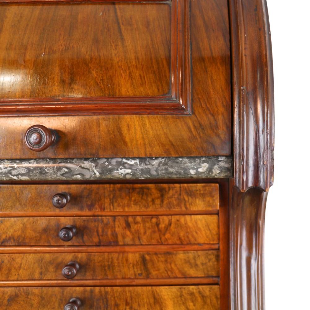 A 19th-century Victorian burr walnut dentist cabinet with a roll-top upper section, shallow drawers, grey marble work surface, and lower two-door cupboard. View XXIV