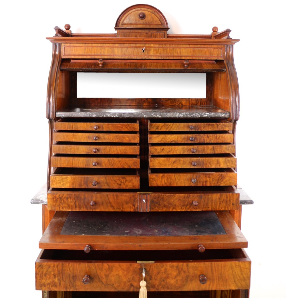 A 19th-century Victorian burr walnut dentist cabinet with a roll-top upper section, shallow drawers, grey marble work surface, and lower two-door cupboard. View XXIX