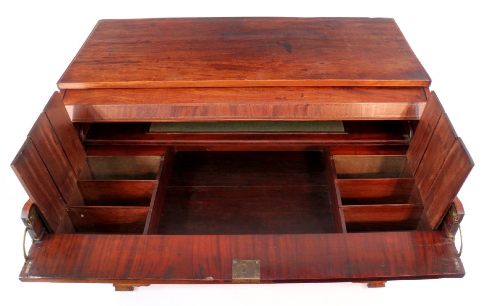 A George III mahogany secretaire low press cupboard featuring flame mahogany veneer panels, brass swan-neck handles, and bracket feet. View XXV