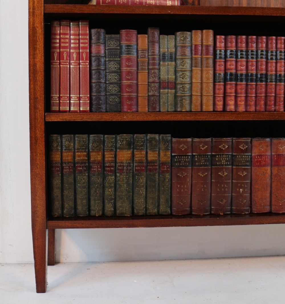 A Victorian walnut open bookcase featuring three horizontal shelves and a decorative brass gallery rail along the top edge. View XIV
