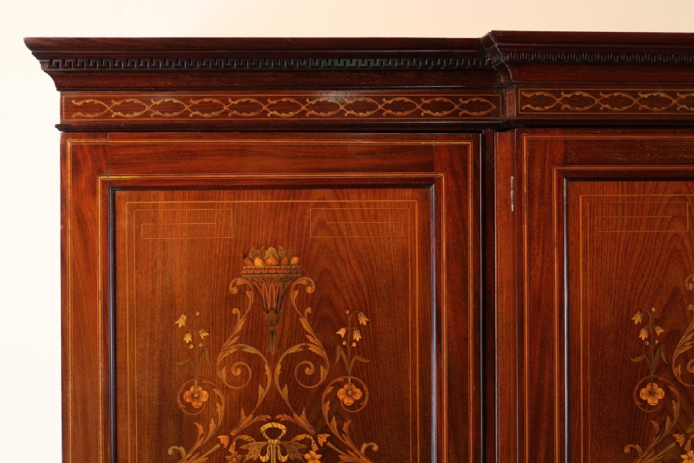A large Victorian mahogany breakfront wardrobe with intricate floral marquetry inlays on the panel doors and lower drawer fronts. View XI