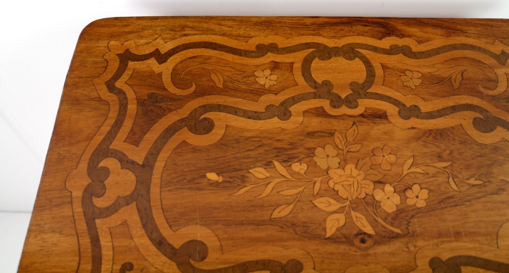 A late 19th-century French Napoleon III work table featuring floral marquetry inlays, ebonised legs, a single lockable drawer, and a lower shelf with brass mouldings. View VI