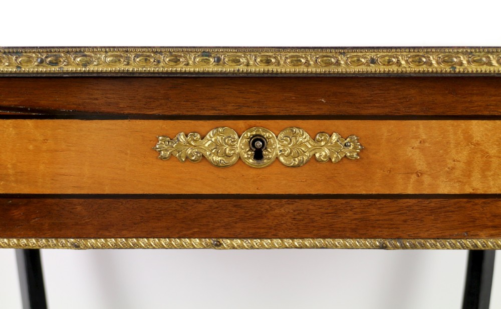 A late 19th-century French Napoleon III work table featuring floral marquetry inlays, ebonised legs, a single lockable drawer, and a lower shelf with brass mouldings. View VIII