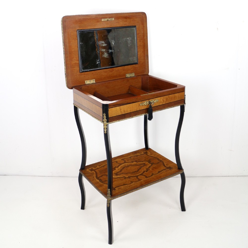 A late 19th-century French Napoleon III work table featuring floral marquetry inlays, ebonised legs, a single lockable drawer, and a lower shelf with brass mouldings. View XVIII