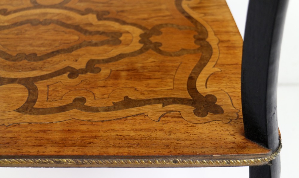 A late 19th-century French Napoleon III work table featuring floral marquetry inlays, ebonised legs, a single lockable drawer, and a lower shelf with brass mouldings. View XXXI