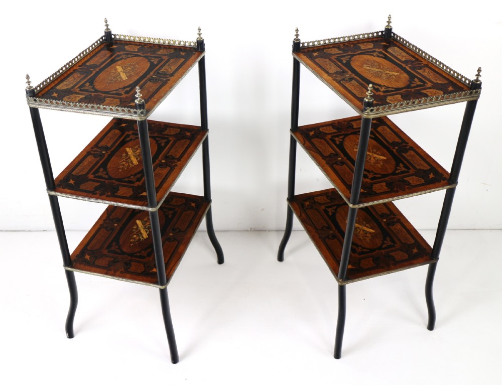 A pair of 19th-century French three-tier etageres featuring inlaid wood marquetry designs, ebonised legs, and pierced brass galleries on top. View VII
