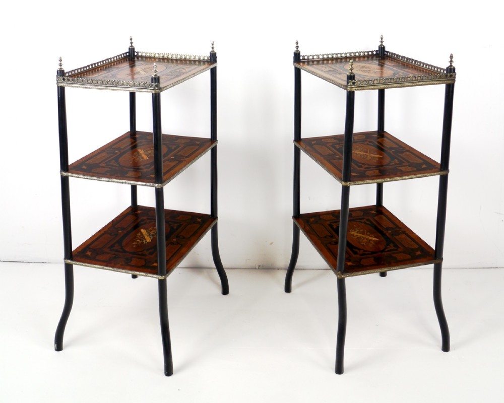 A pair of 19th-century French three-tier etageres featuring inlaid wood marquetry designs, ebonised legs, and pierced brass galleries on top. View VIII