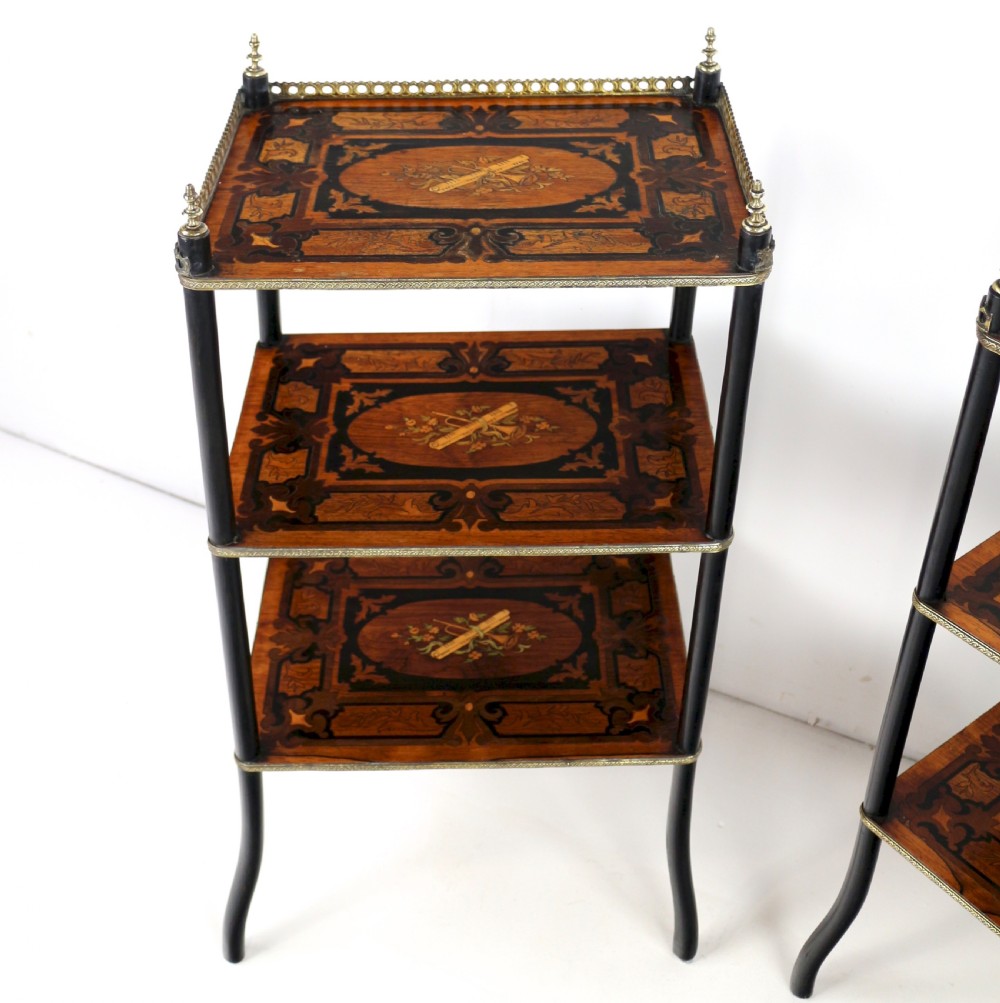 A pair of 19th-century French three-tier etageres featuring inlaid wood marquetry designs, ebonised legs, and pierced brass galleries on top. View XII