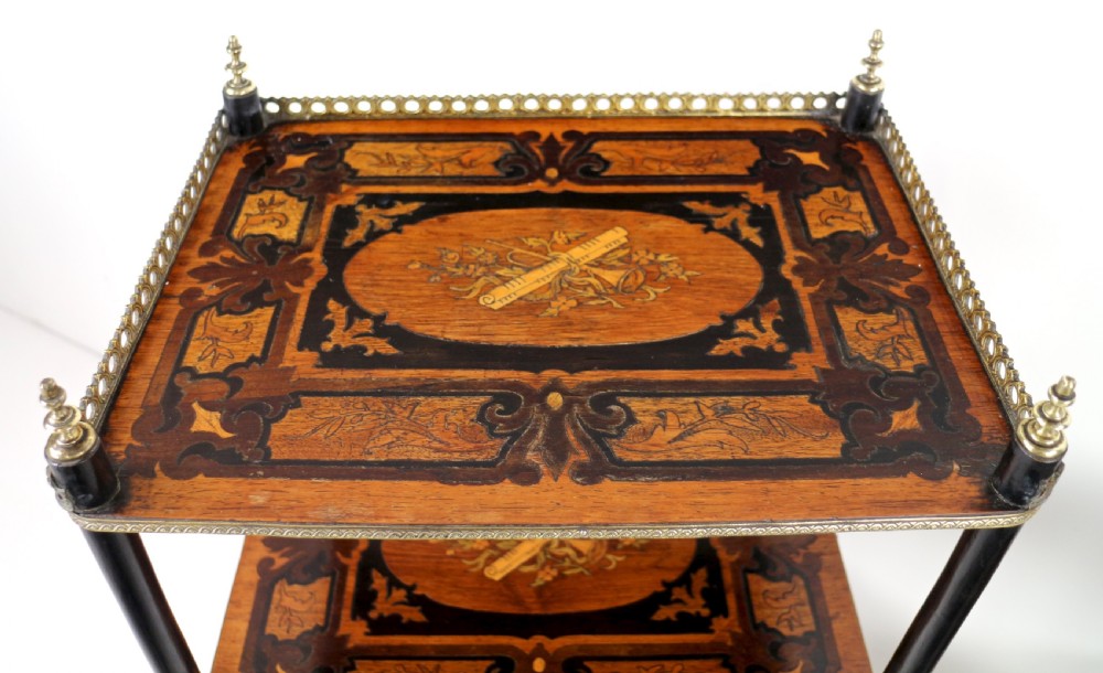 A pair of 19th-century French three-tier etageres featuring inlaid wood marquetry designs, ebonised legs, and pierced brass galleries on top. View XIII