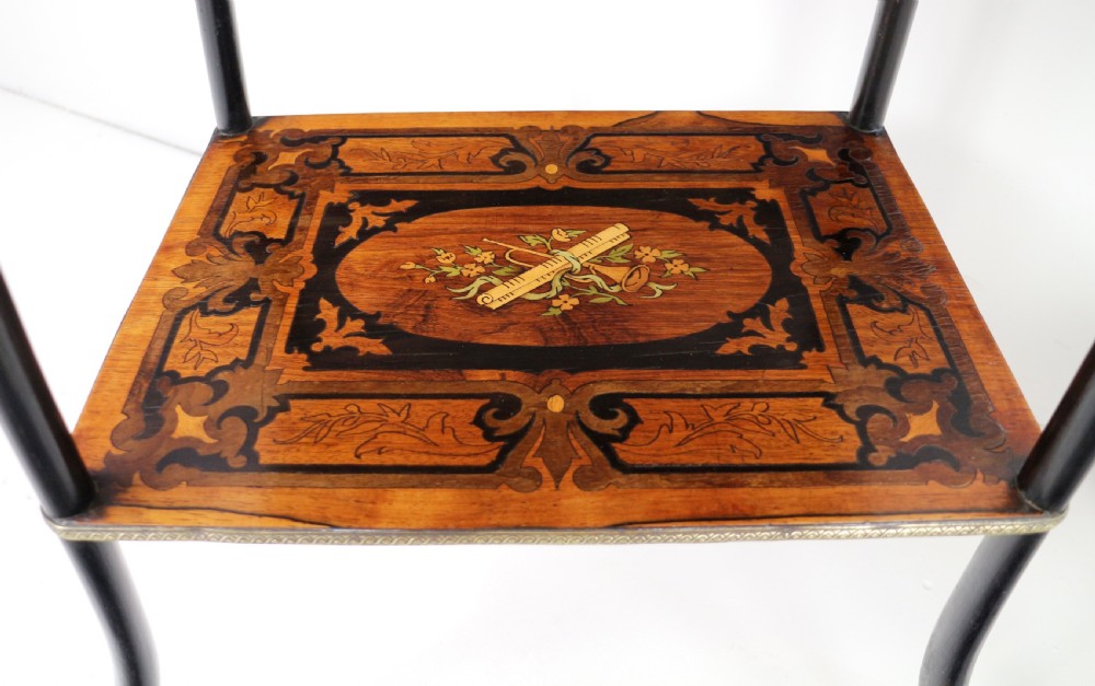 A pair of 19th-century French three-tier etageres featuring inlaid wood marquetry designs, ebonised legs, and pierced brass galleries on top. View XV