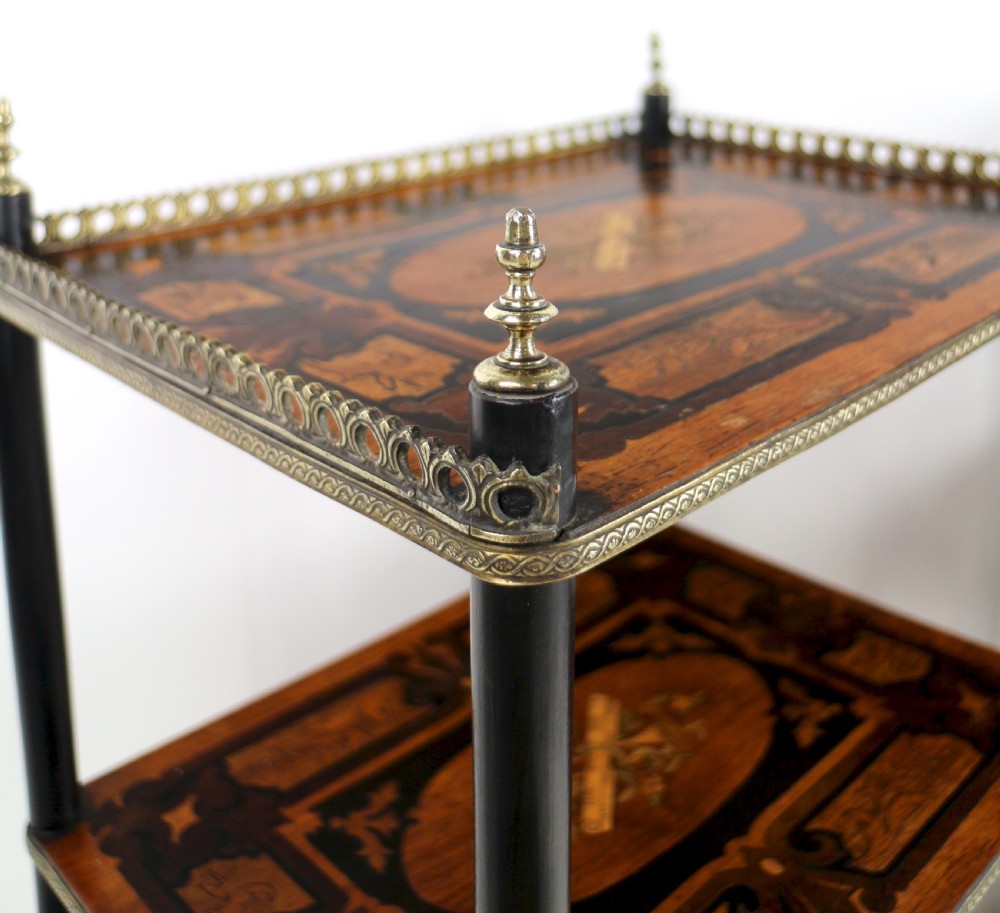 A pair of 19th-century French three-tier etageres featuring inlaid wood marquetry designs, ebonised legs, and pierced brass galleries on top. View XVI