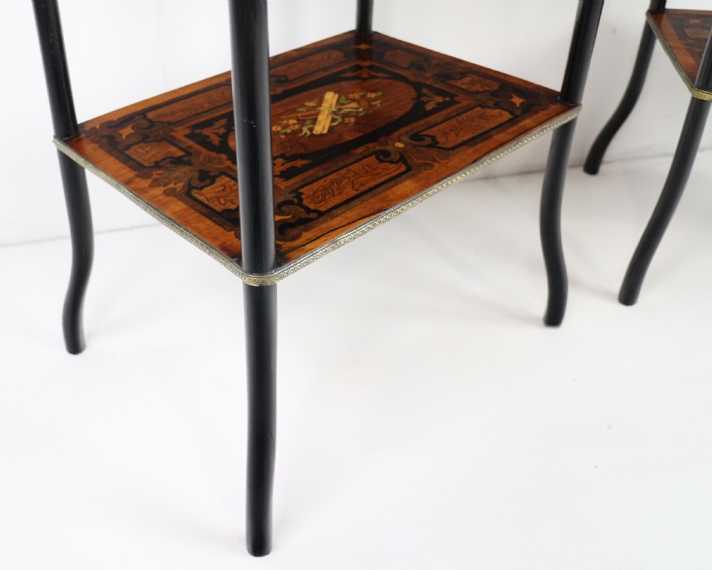 A pair of 19th-century French three-tier etageres featuring inlaid wood marquetry designs, ebonised legs, and pierced brass galleries on top. View XVII