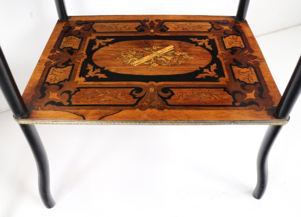 A pair of 19th-century French three-tier etageres featuring inlaid wood marquetry designs, ebonised legs, and pierced brass galleries on top. View XXII