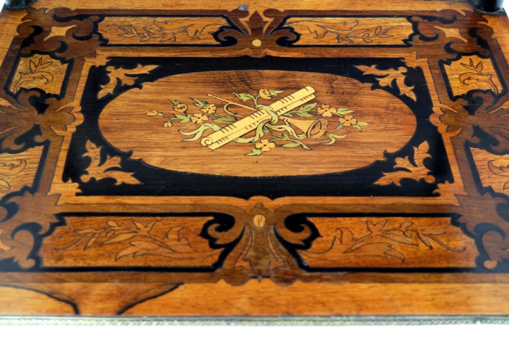 A pair of 19th-century French three-tier etageres featuring inlaid wood marquetry designs, ebonised legs, and pierced brass galleries on top. View XXIII