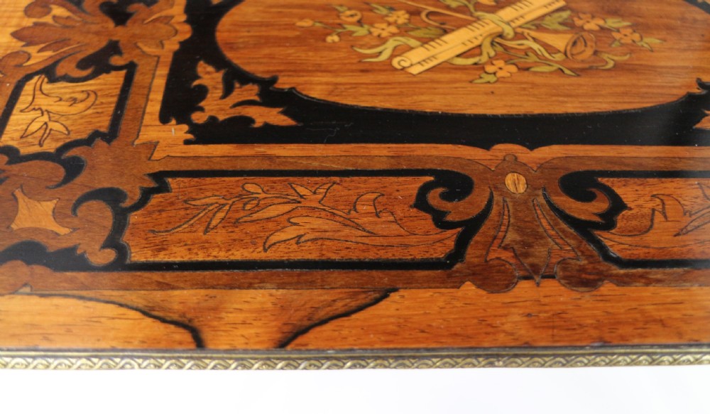 A pair of 19th-century French three-tier etageres featuring inlaid wood marquetry designs, ebonised legs, and pierced brass galleries on top. View XXV