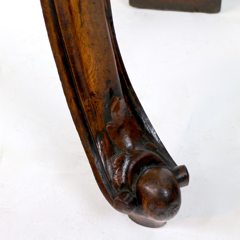 An antique William IV oak hall table featuring carved cabriole front legs and a central carved apron accent. View XIV