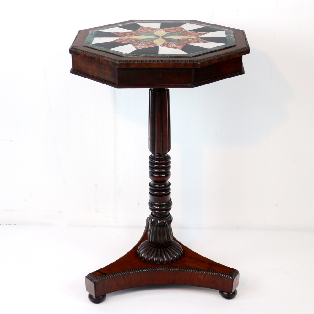 An octagonal Regency mahogany side table featuring a geometric star-patterned specimen marble top supported by a reeded column and triform base. View III