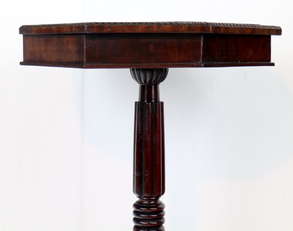An octagonal Regency mahogany side table featuring a geometric star-patterned specimen marble top supported by a reeded column and triform base. View XI