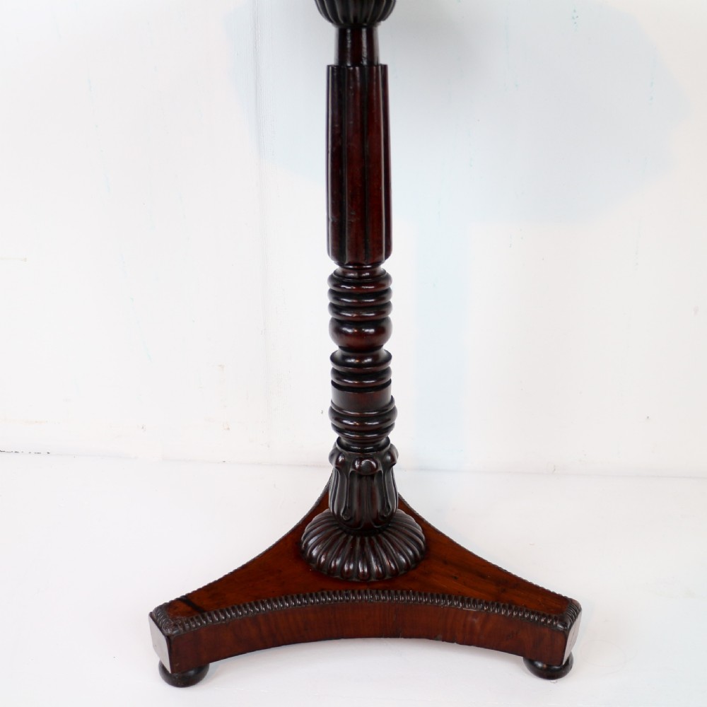 An octagonal Regency mahogany side table featuring a geometric star-patterned specimen marble top supported by a reeded column and triform base. View XII