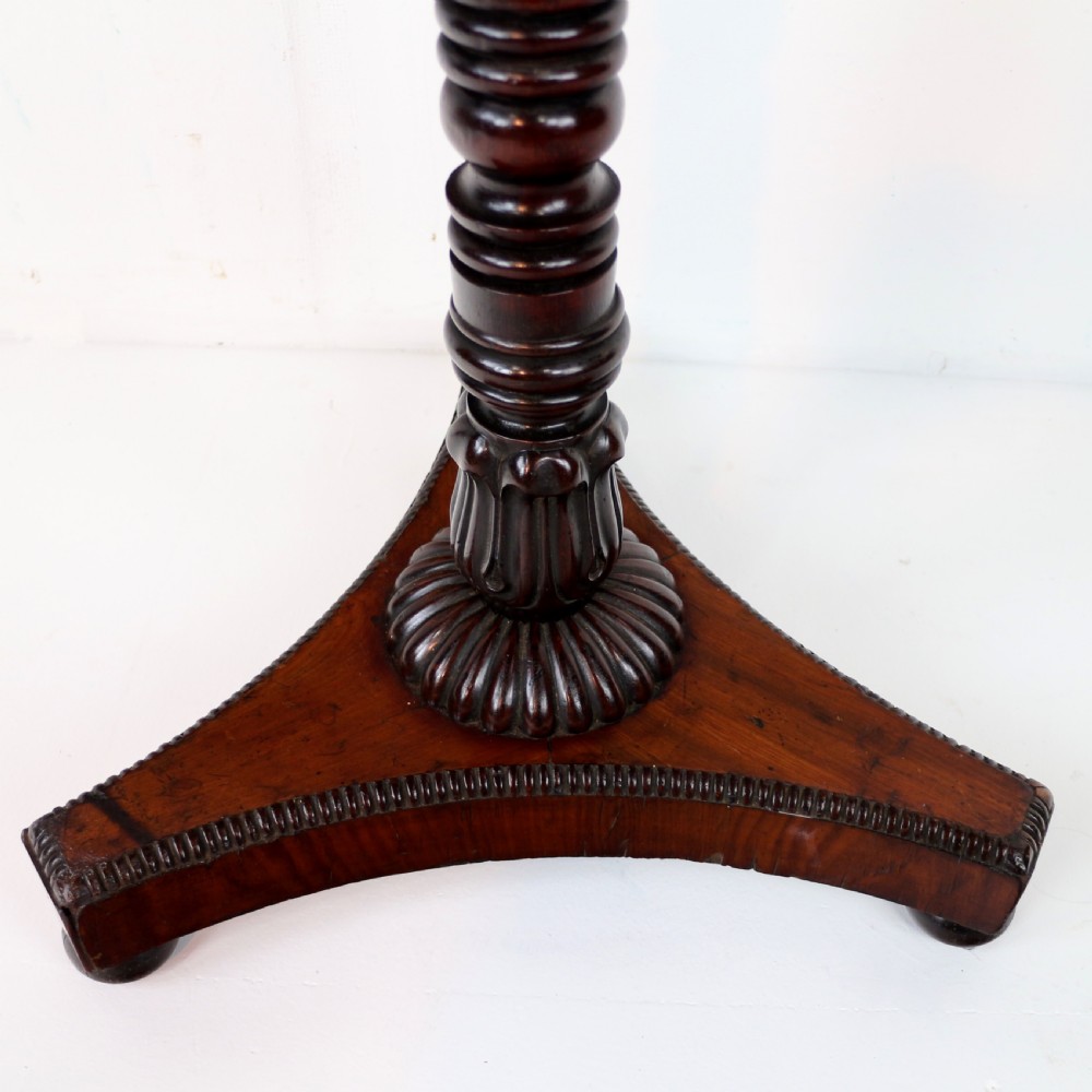 An octagonal Regency mahogany side table featuring a geometric star-patterned specimen marble top supported by a reeded column and triform base. View XIII