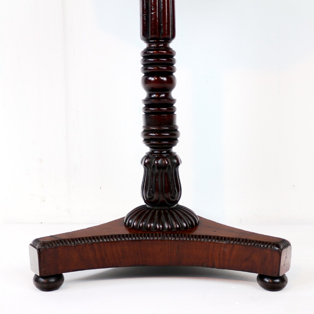 An octagonal Regency mahogany side table featuring a geometric star-patterned specimen marble top supported by a reeded column and triform base. View XIV