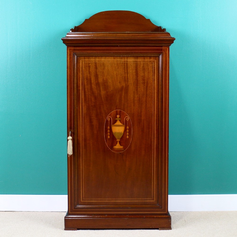 A Victorian mahogany music side cabinet featuring satinwood stringing, a central urn marquetry medallion on the door, and a shaped gallery top. View II