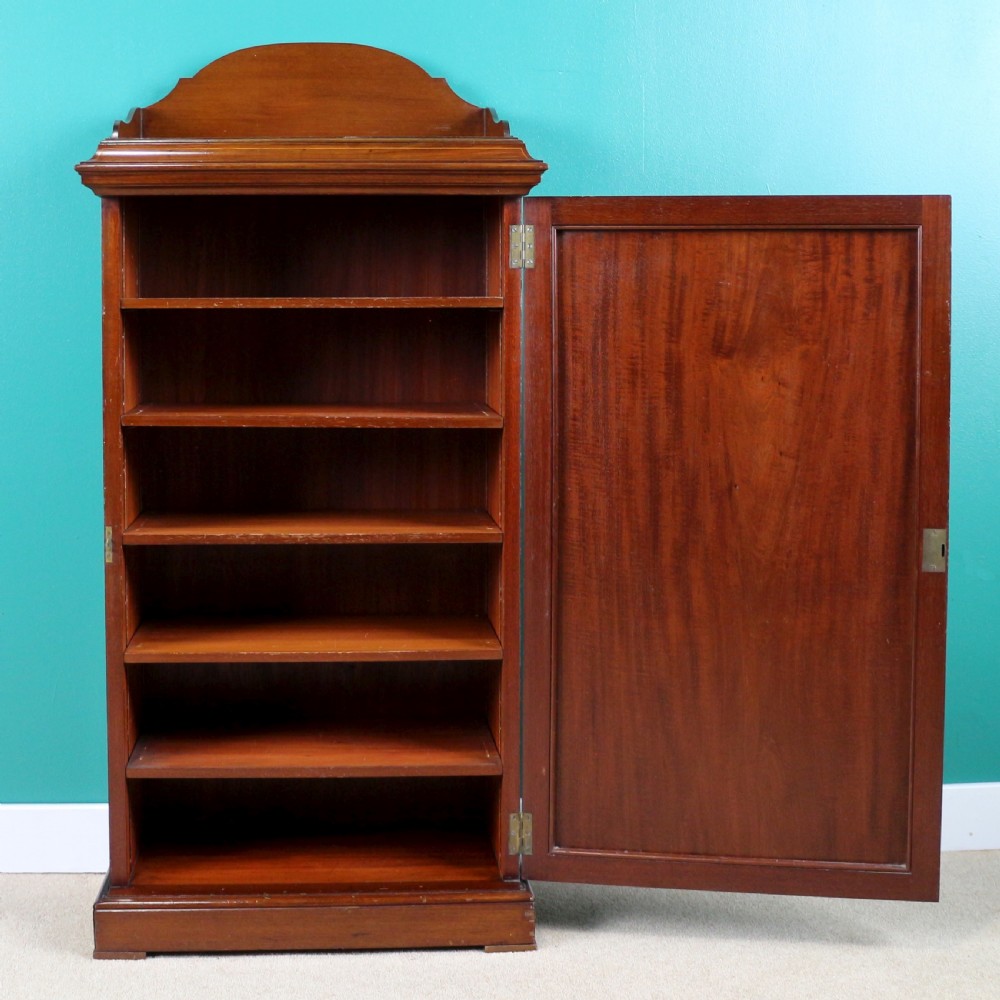 A Victorian mahogany music side cabinet featuring satinwood stringing, a central urn marquetry medallion on the door, and a shaped gallery top. View XV