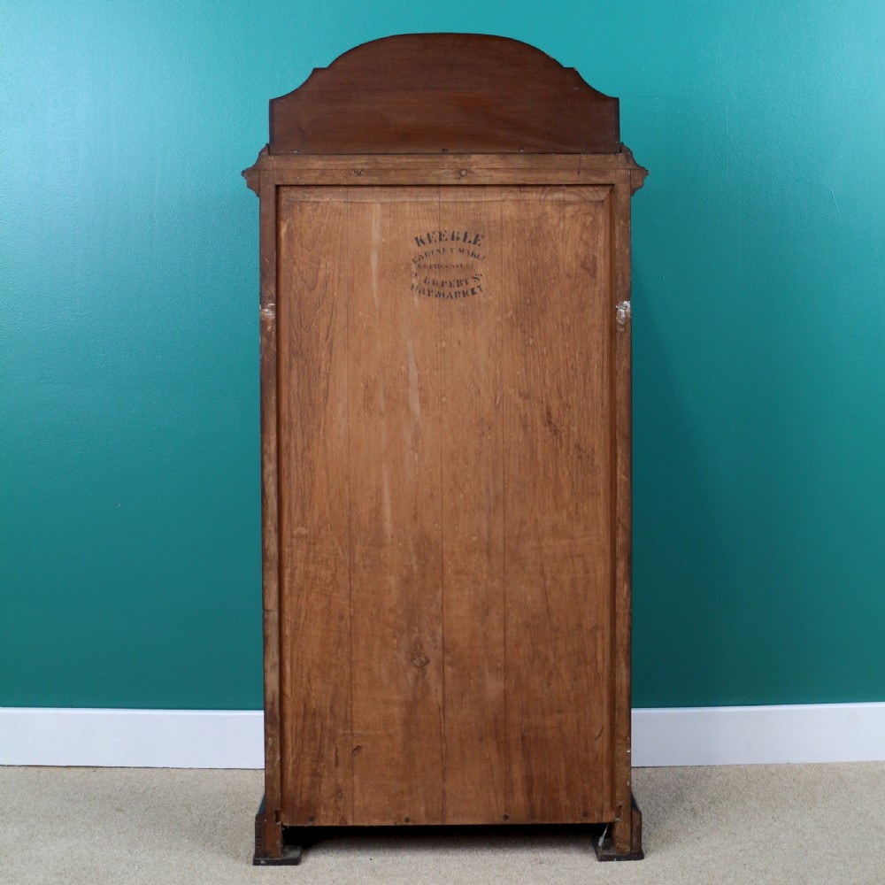 A Victorian mahogany music side cabinet featuring satinwood stringing, a central urn marquetry medallion on the door, and a shaped gallery top. View XVII