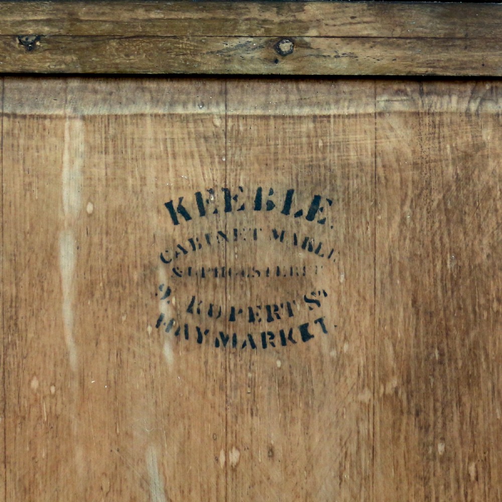 A Victorian mahogany music side cabinet featuring satinwood stringing, a central urn marquetry medallion on the door, and a shaped gallery top. View XVIII