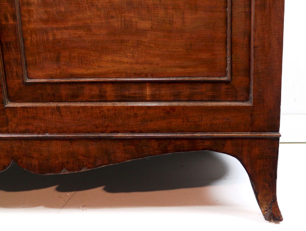 A George III mahogany secretaire bookcase featuring twin astragal glazed doors above a fitted writing drawer and lower panelled doors. View XIII