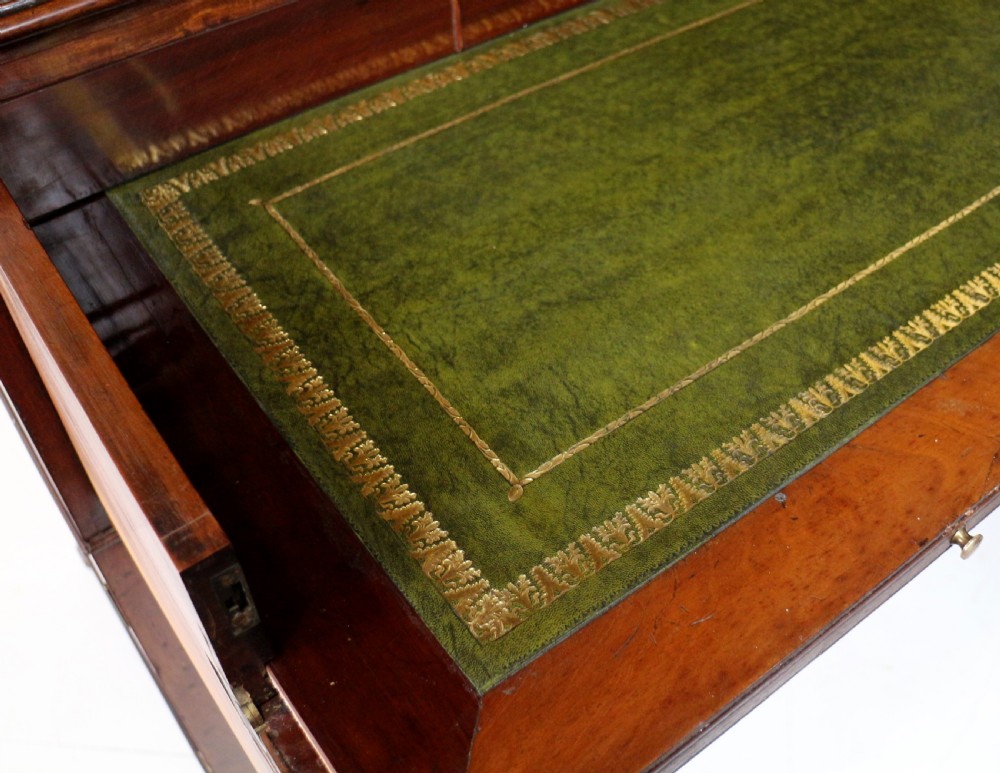 A George III mahogany secretaire bookcase featuring twin astragal glazed doors above a fitted writing drawer and lower panelled doors. View XVIII