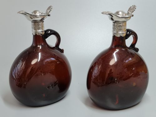 Superb Pair19th Century Matched Dark Amber Glass Decanters with Engraved Silver Plate Mounts