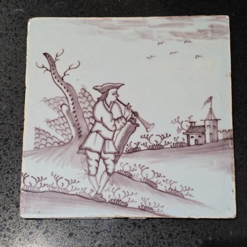 18th century liverpool delft manganese tile man playing a flute - CATEGORY: ANTIQUE CERAMICS - DATED 18TH CENTURY