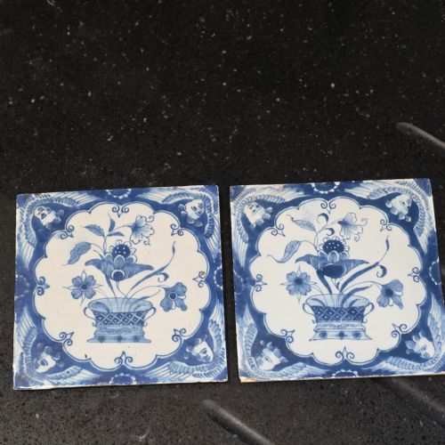 pr of 18thc liverpool delft tiles angel head corners and floral arrangement circa 1750 - CATEGORY: ANTIQUE CERAMICS - DATED 18TH CENTURY