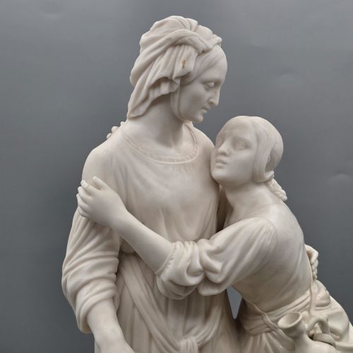 fig 1. A Victorian off-white parian porcelain figural group depicting three women in classical draped robes on an oval base.