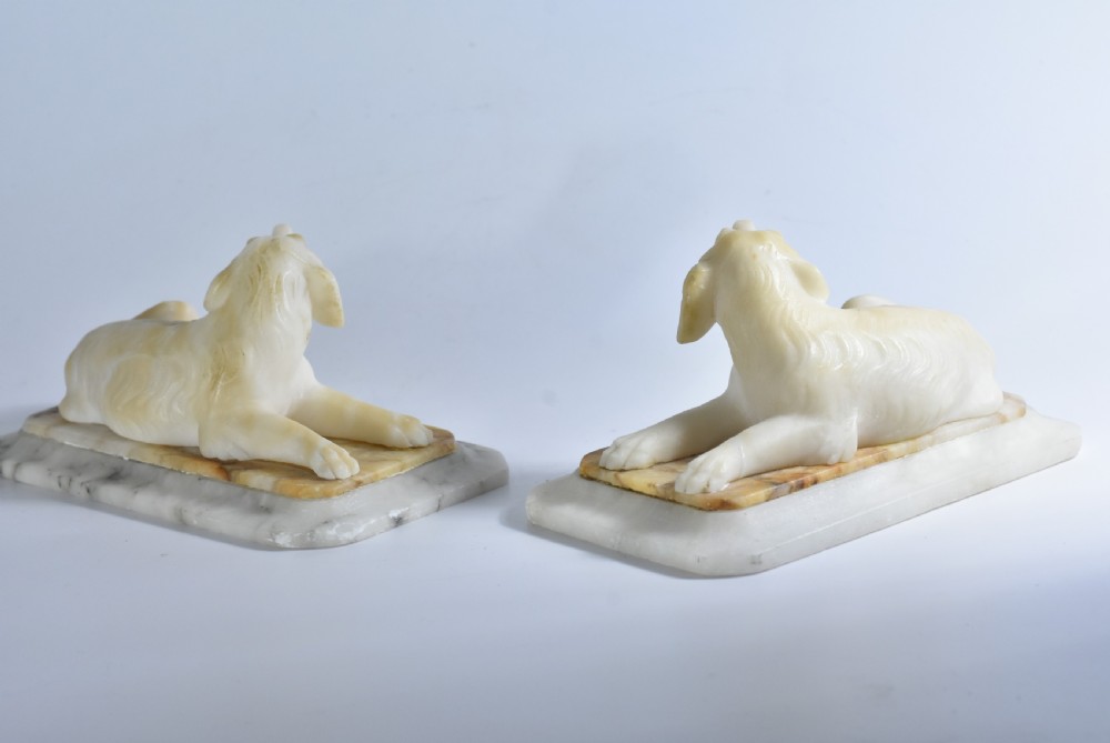 Fine pair of vintage carved alabaster recumbent dogs on a marble base c1900 View III