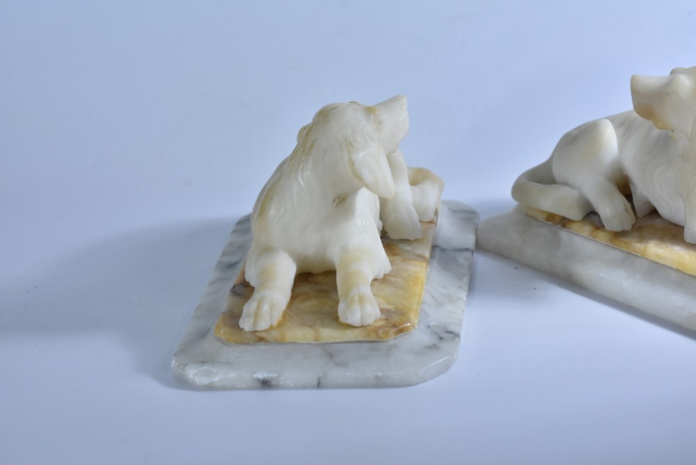 Fine pair of vintage carved alabaster recumbent dogs on a marble base c1900 View VIII
