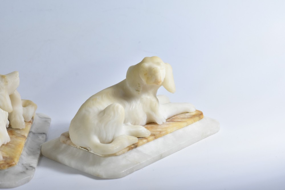 Fine pair of vintage carved alabaster recumbent dogs on a marble base c1900 View IX