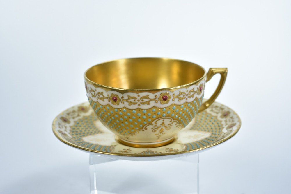 A Coalport Turquoise & Jewelled & Gilt Cabinet Cup & Saucer