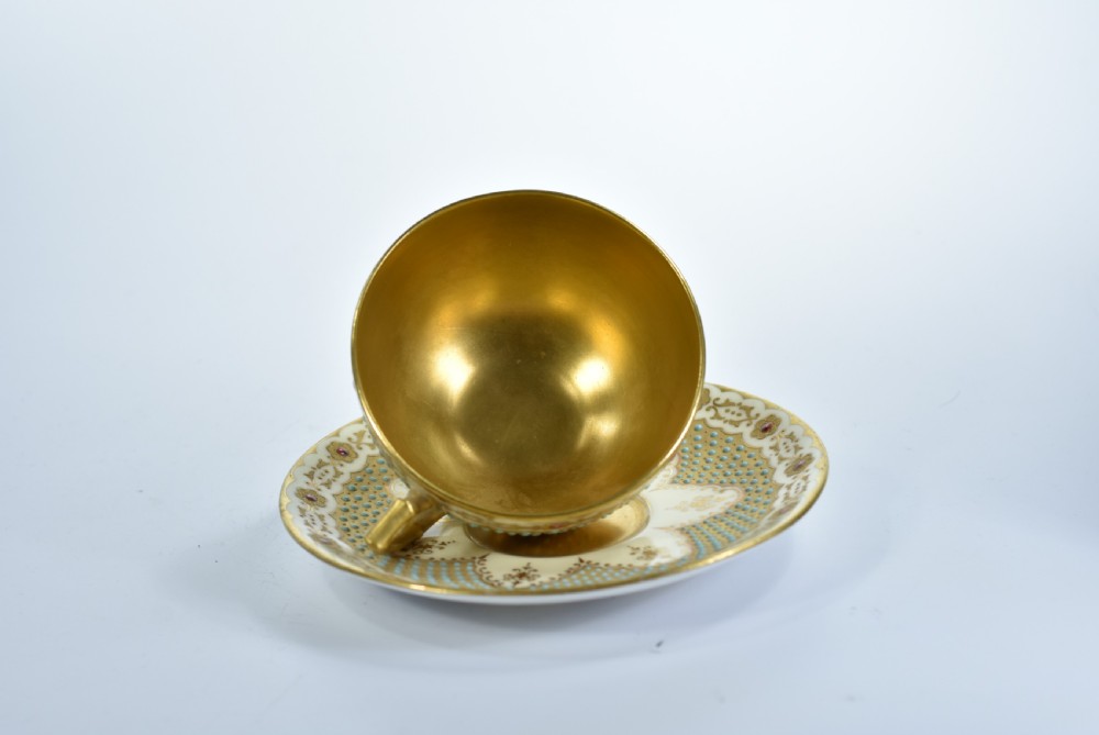 A Coalport Turquoise & Jewelled & Gilt Cabinet Cup & Saucer View V