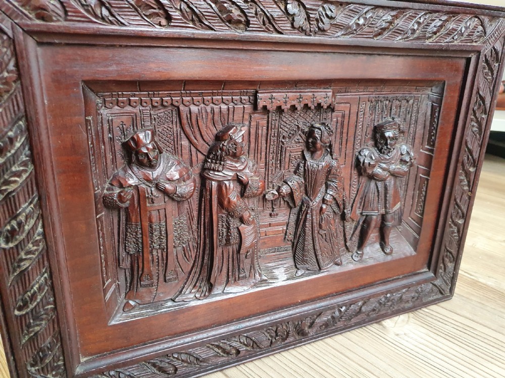 A Victorian Mahogany Carved Relief Panel Depicting Tudor Interior Scene View II